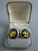 A PAIR OF CIRCULAR BLACK ENAMEL WEDGWOOD CUFFLINKS, each decorated with a gilt horse's head