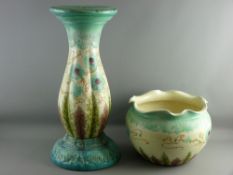 A VICTORIAN MAJOLICA POTTERY JARDINIERE ON STAND, colourful floral and leaf tube line pattern on a