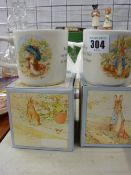 Two boxed 'Peter Rabbit' and 'Benjamin Bunny' Wedgwood mugs, two bunny plates and a Chelsea Flower