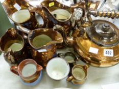 Pair of large copper lustre blue decorated jugs, large copper lustre tea kettle and other copper