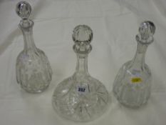 Three cut glass decanters