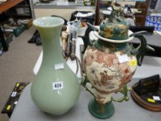 Two handled Oriental pottery vase and a green celadon vase with an open base