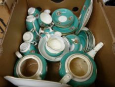 Large parcel of 19th Century green breakfast ware, each piece with a small landscape panel