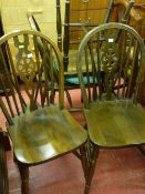Set of four wheelback dining chairs