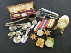Tray of pens, cased silver spoon, silver napkin ring, medals and ribbons etc