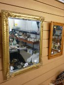 Gilt framed bevelled wall mirror and a pine framed wall mirror