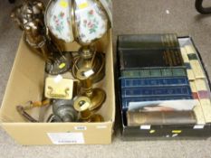 Pair of oval based brass candleholders, table lamp, composition figural group, a small carriage