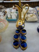 Fancy Bristol blue and gilt decorated liqueur decanter and six glasses