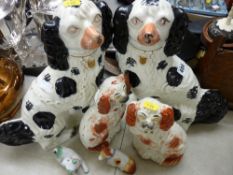 Pair of Staffs black and white seated dogs, pair of small red and white dogs and two other small