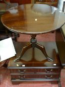 Reproduction circular tripod table and a TV cabinet