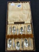 Cased set of six silver coffee spoons with crossed golf club handles