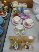 Pair of alabaster bookends and small parcel of cups, saucers and mugs