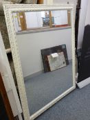 Large white scrolled pattern framed wall mirror
