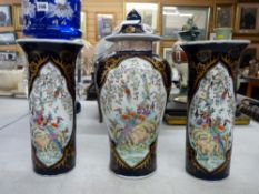 Oriental three piece garniture set of pair of chimney vases and centre baluster vase with knopped