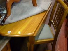 Modern breakfast table with a set of four chairs by H J Berry