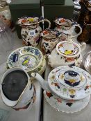Graduated set of three Masons Ironstone Mandalay jugs and a circular teapot, a Bursleigh ware teapot