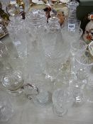 Large parcel of mixed glassware including three decanters and a celery vase