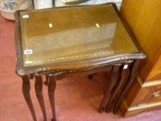 Leather effect and glass topped nest of three coffee tables
