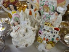 Three Staffs figure groups, a Staffs castle tower ornament, two Royal Doulton large Toby jugs '