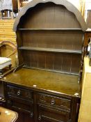 Dome topped compact polished dresser