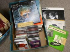 Box of CDs and LP records