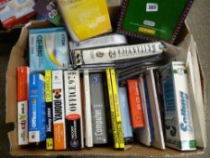 Box of computer related books, discs etc and a home computer version of Scrabble