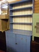 A painted rustic pine dresser