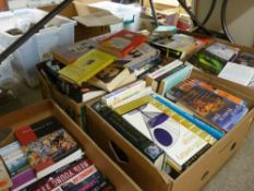 A large quantity in several boxes of paperbacks & other reading material