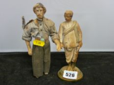 A carved Eastern figure & a primitive doll