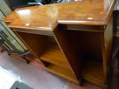 A yew wood breakfront open bookcase with adjustable shelves