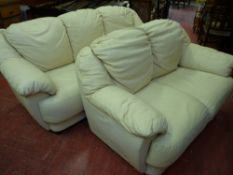 A 3 seater and similar 2 seater cream coloured leather effect settee