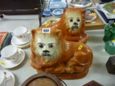 A pair of Staffordshire lions