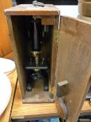 A wooden cased scientific microscope