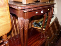 A reproduction set of three glass topped side tables