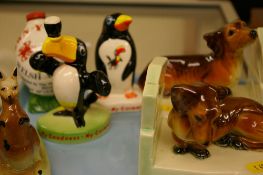 Three Carltonware Guinness figures, a pair of continental bookends etc
