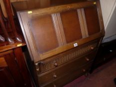 A Priory-style oak front bureau