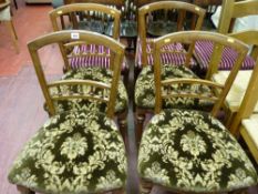 A set of four Edwardian salon chairs with spindle gallery back