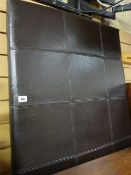 A modern brown leather-effect headboard