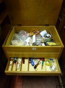 A lightwood lidded sewing trolley & contents