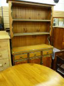 A modern pine dresser & matching circular table with green highlighting