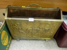 A brass plough scene decorated magazine rack