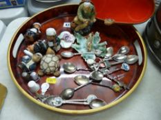 A lacquered tray with mixed collectable contents