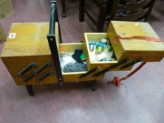 A concertina-type sewing box with contents