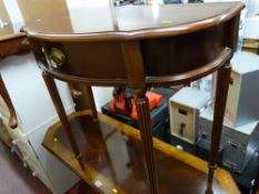 A reproduction single drawer serpentine front hall table