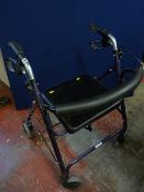 A wheeled folding walking aid