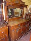 An Art Nouveau-style oak linear mirror back sideboard