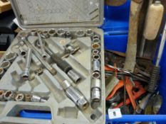 A blue tub full of hand tools