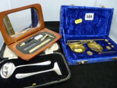 A cased set of jewellery scales, a gentleman's vanity set and a spoon & pusher set