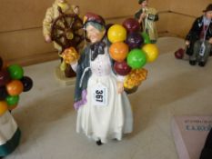 A Royal Doulton pottery figurine 'Biddy Pennyfarthing' HN1843