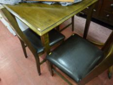 A modern oak effect dining table & four chairs